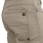 Tactical pants with extended pocket reinforcement